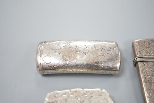 A George III silver oval patch box, John Taylor, Birmingham, 1800, 36mm, a Georgian silver concave combination snuff box/vinaigrette, Samuel Pemberton, Birmingham, 1809?, a Victorian silver pill box and a similar silver